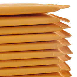 A neat stack of golden kraft Sure Seal bubble mailers, fanned so their sealing flaps are visible.